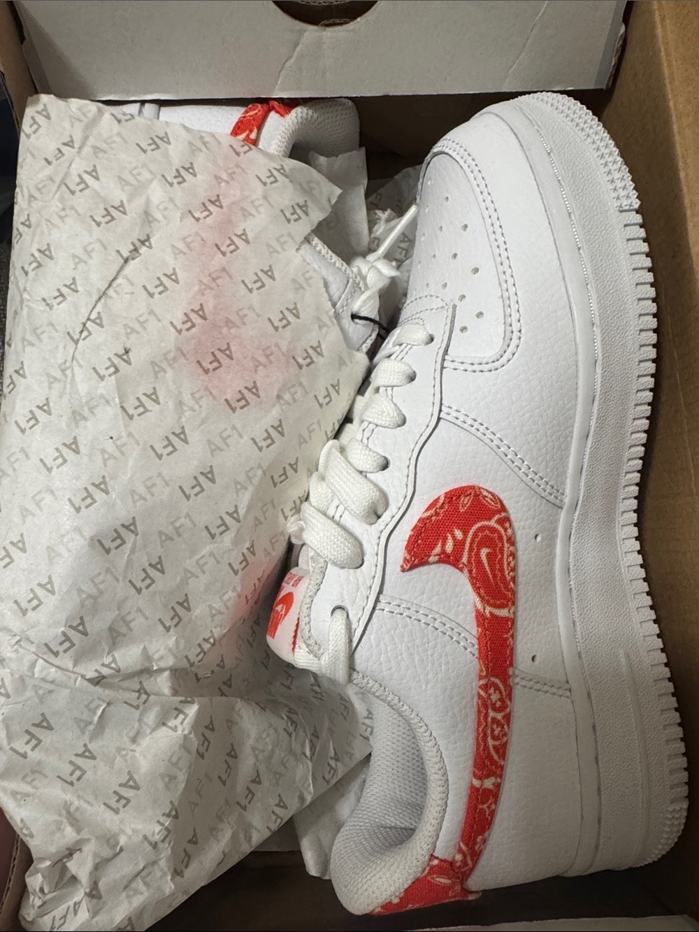 Nike Air Force 1s Sneakers with orange Paisley Swoosh
